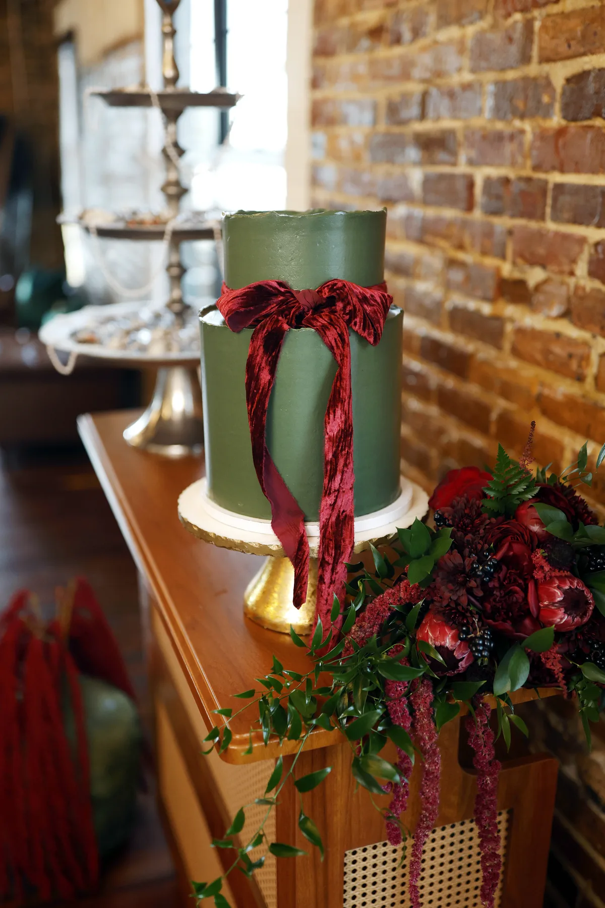 Green holiday cake with gold details